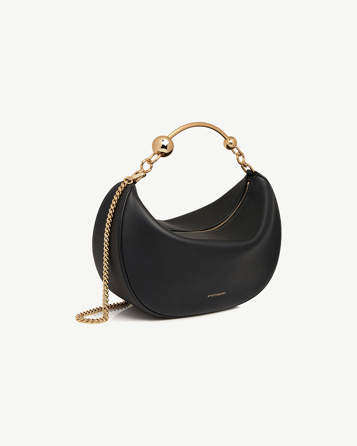 Black Crescent Moon bag with gold hoop handle and chain strap, Strathberry logo.