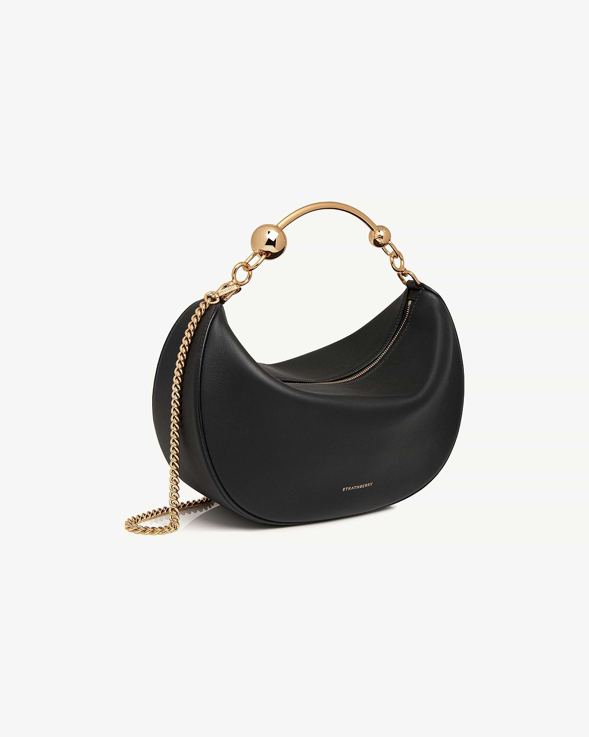 Black Crescent Moon bag with gold hoop handle and chain strap, Strathberry logo.