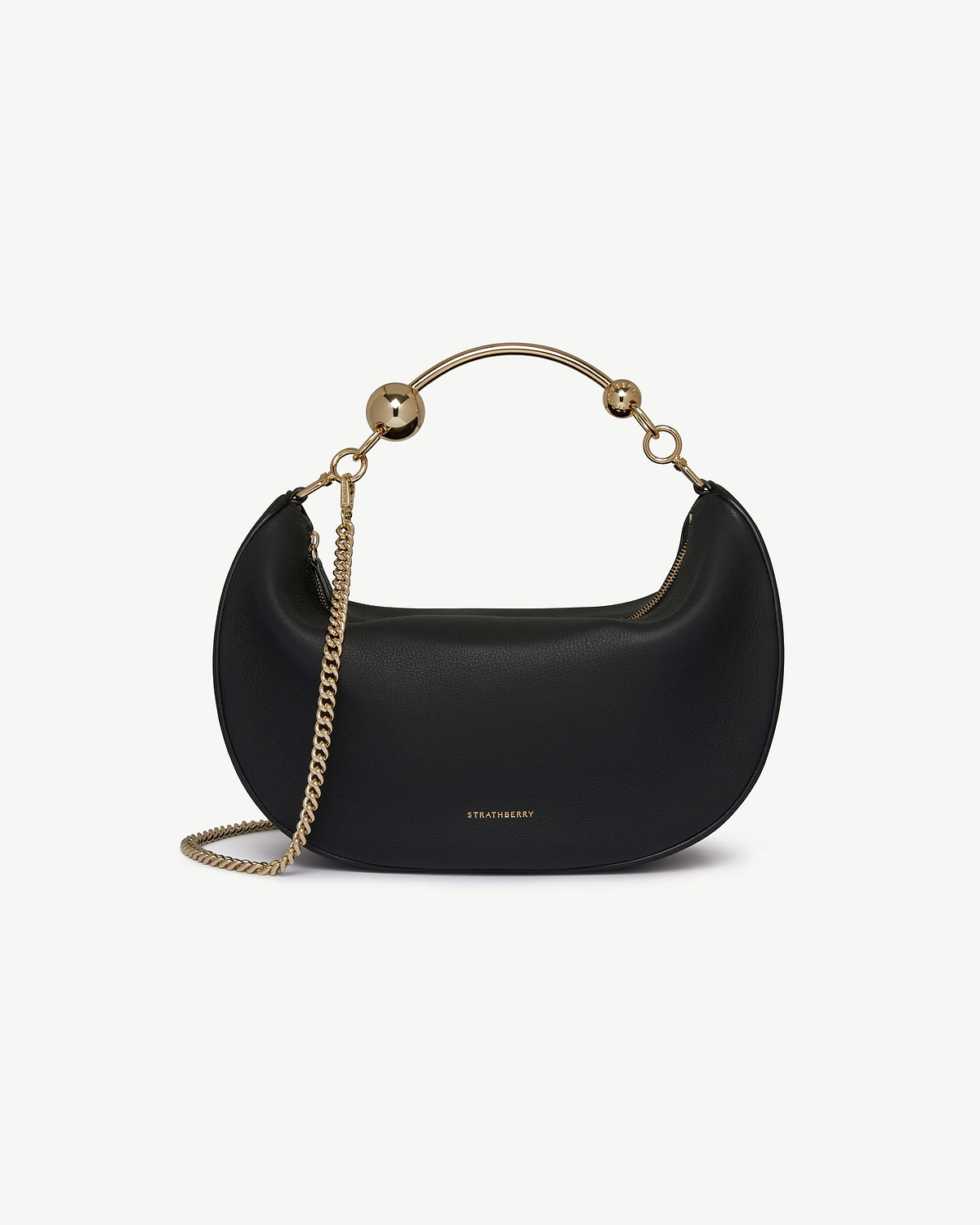 Black Strathberry Crescent Moon leather shoulder bag with gold top handle and chain.