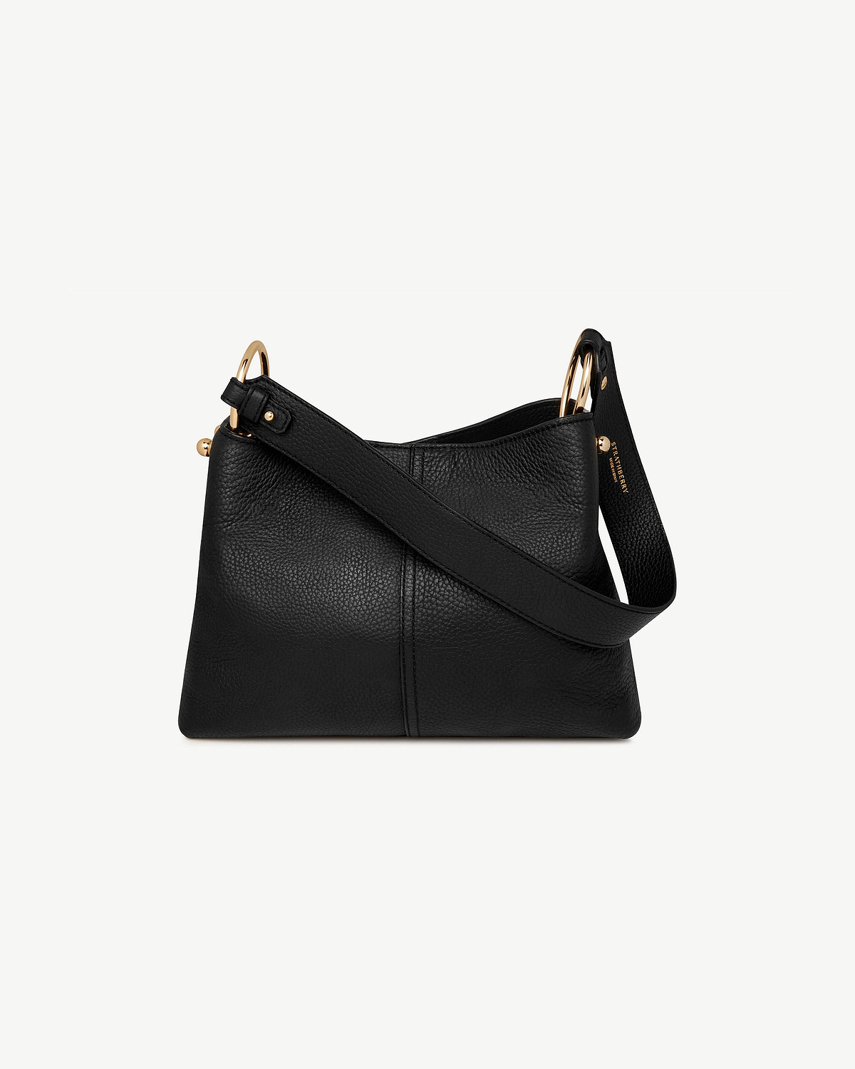 Black pebbled leather Lana hobo bag with Strathberry stamped strap and gold rings.
