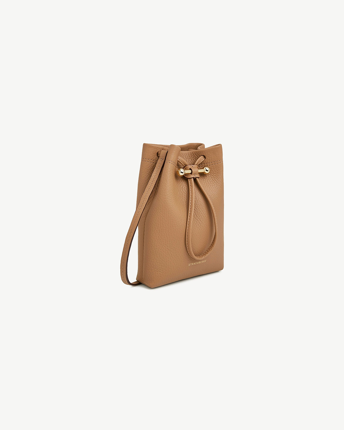 Caramel leather Osette midi pouch with drawstring and embossed Strathberry logo.