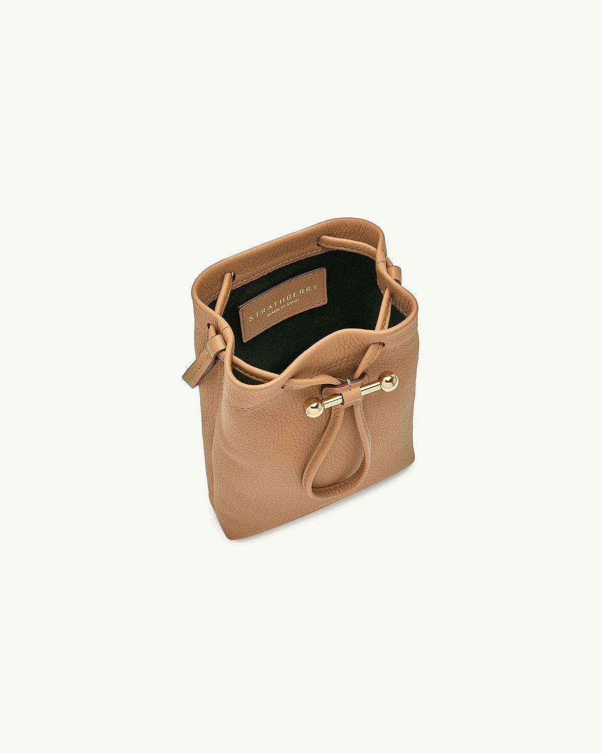 Caramel leather midi pouch by Strathberry with drawstring and gold bar hardware