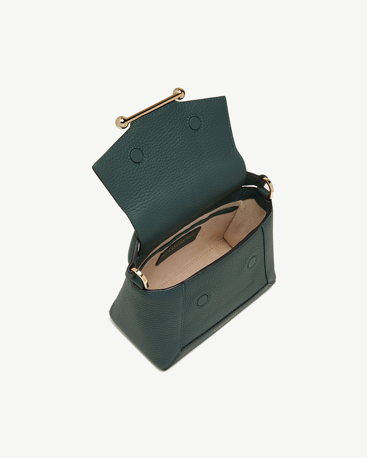 Bottle green leather mini bag open, showing beige interior and gold bar clasp.