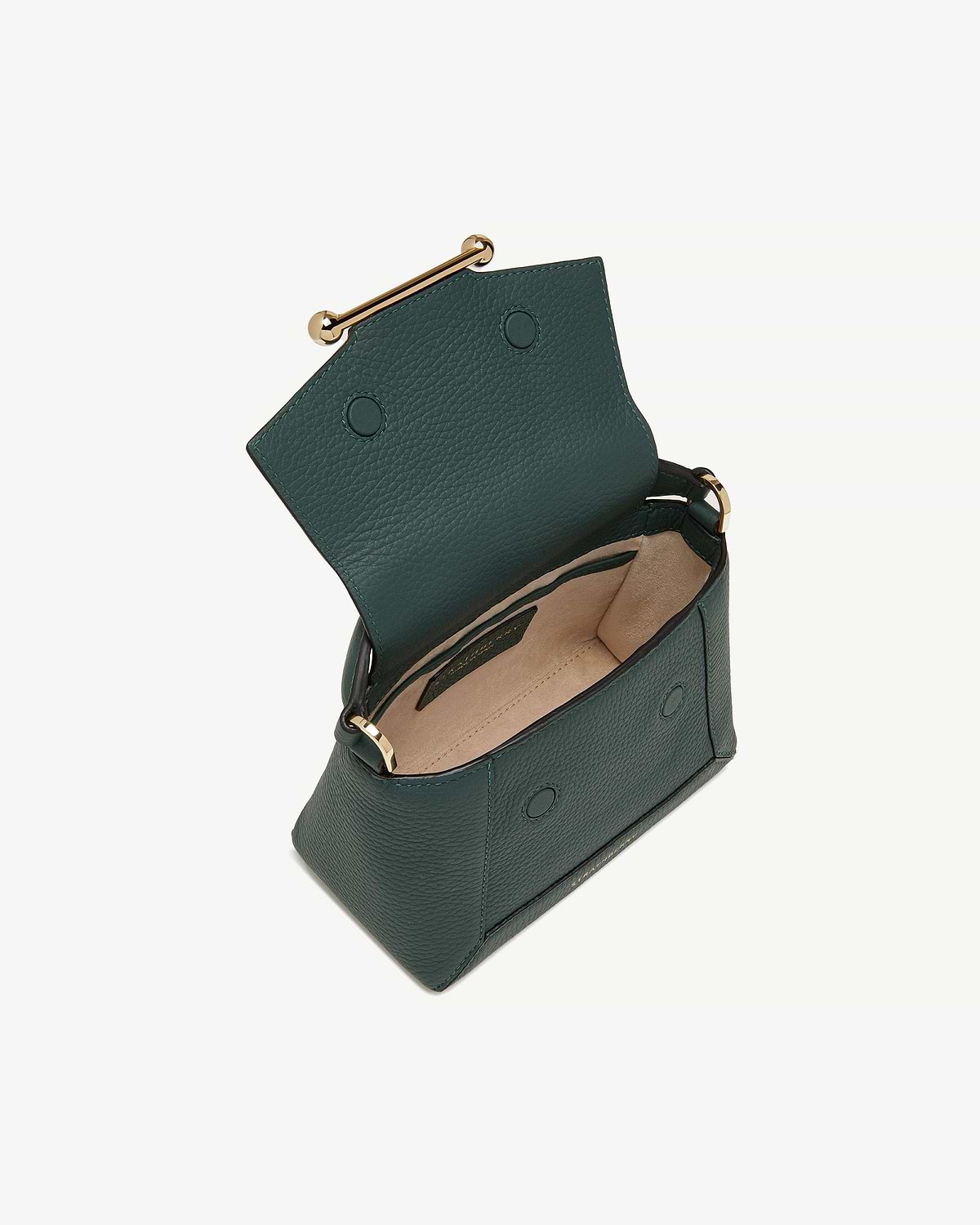 Bottle green leather mini bag open, showing beige interior and gold bar clasp.