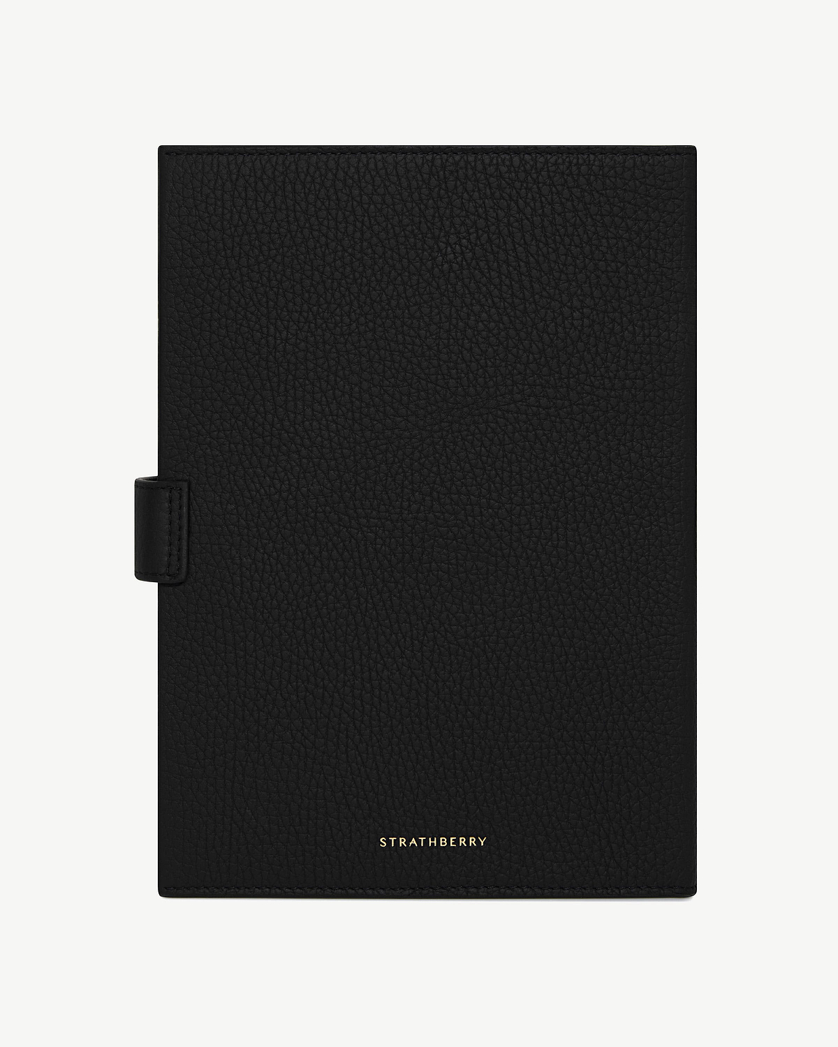 Black Multrees notebook with pebbled leather cover and gold Strathberry logo.