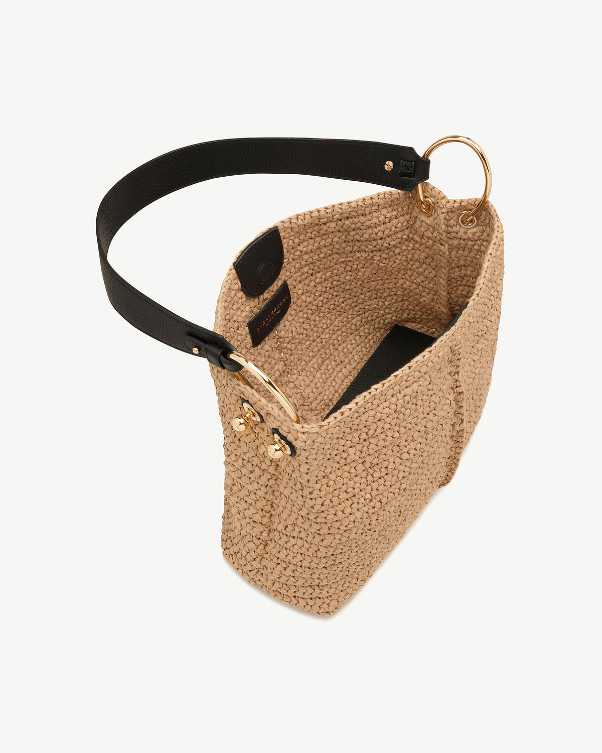 Raffia Strathberry hobo bag with black leather strap and gold ring hardware.