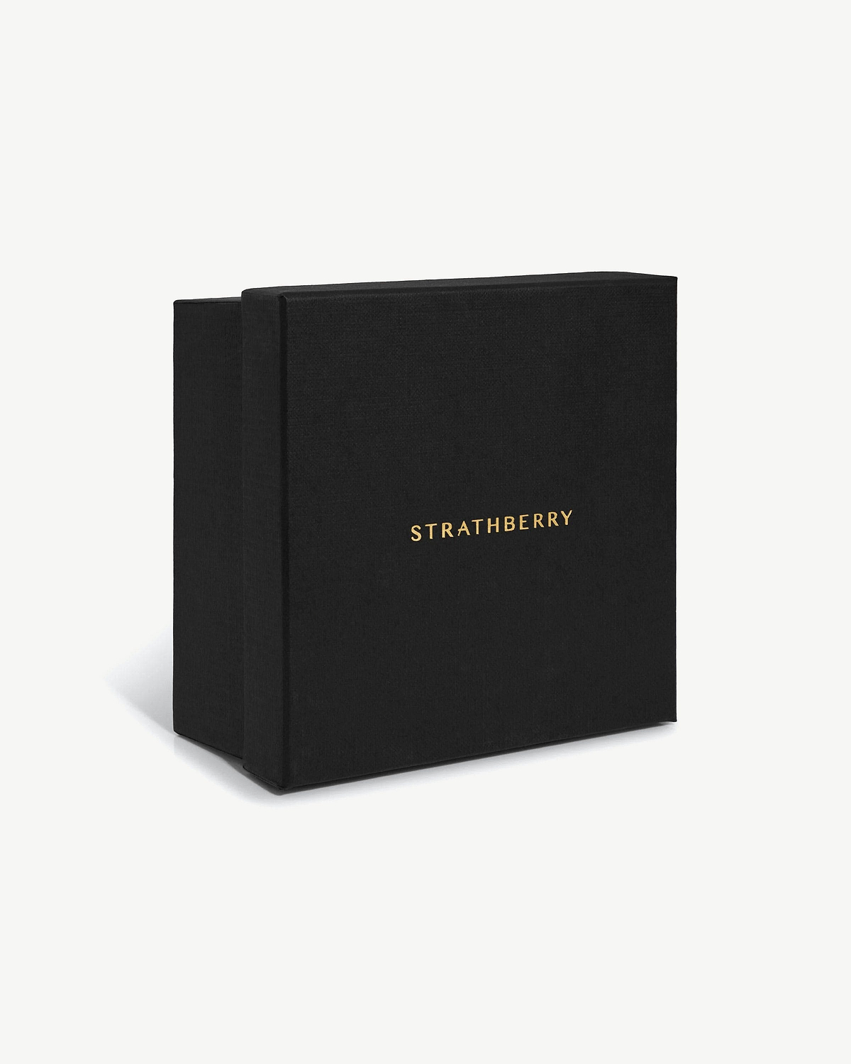 Black Strathberry jewellery box with gold logo on a white background.