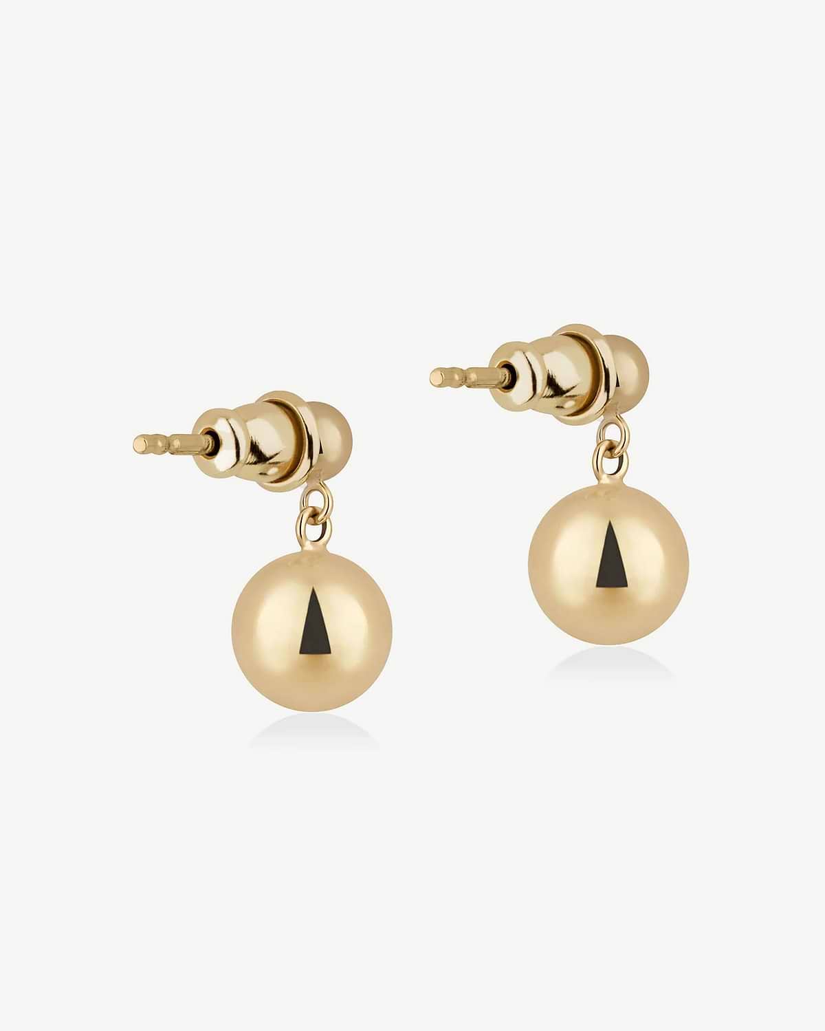 Pair of gold-gilded drop earrings with spherical drops and black triangle detail