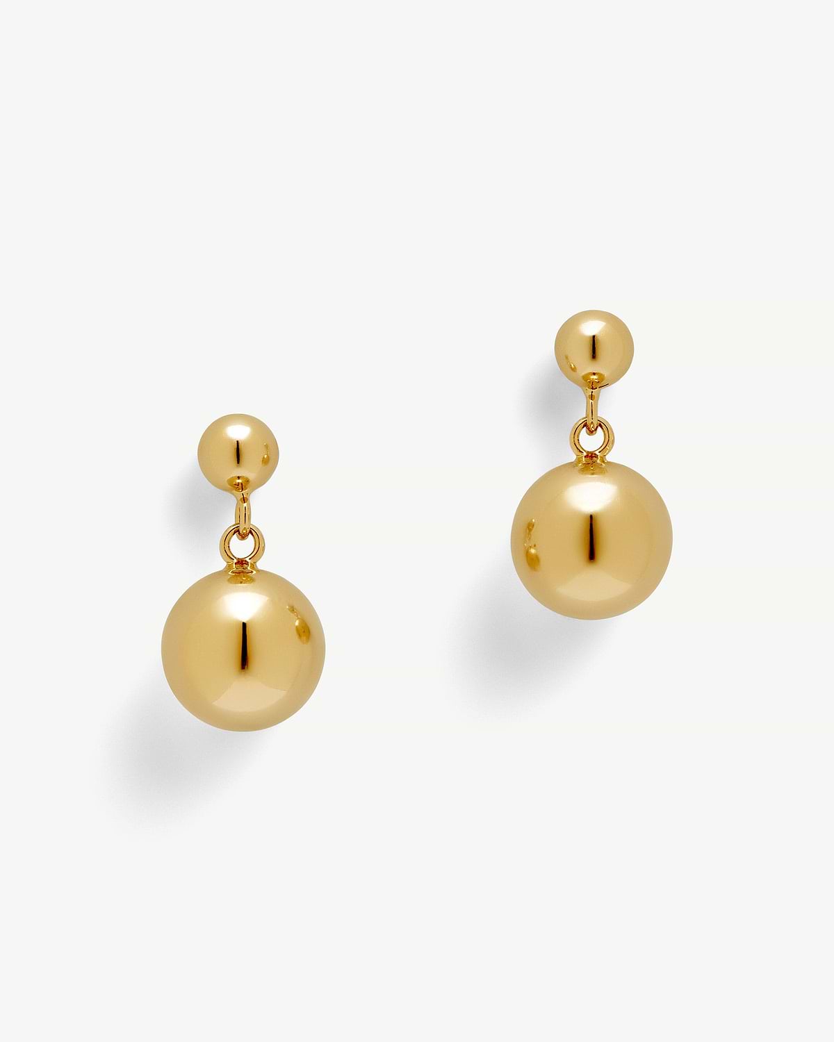 Pair of 22 carat gold gilded drop earrings with polished spherical beads.