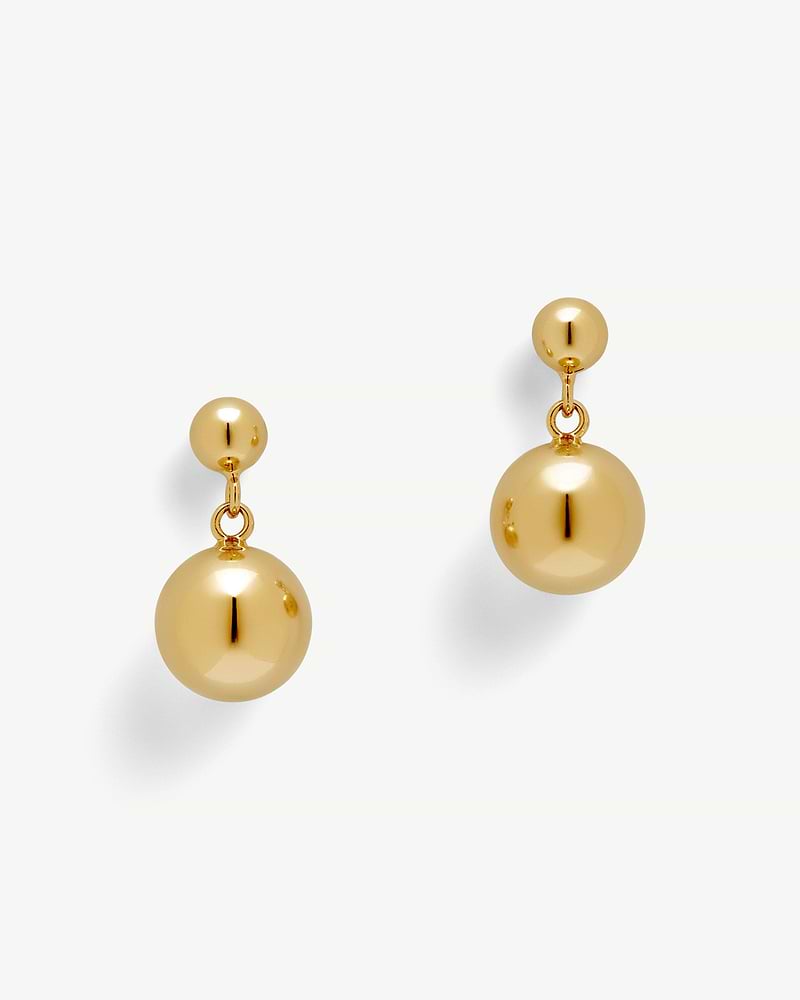 Pair of 22 carat gold gilded drop earrings with polished spherical beads.