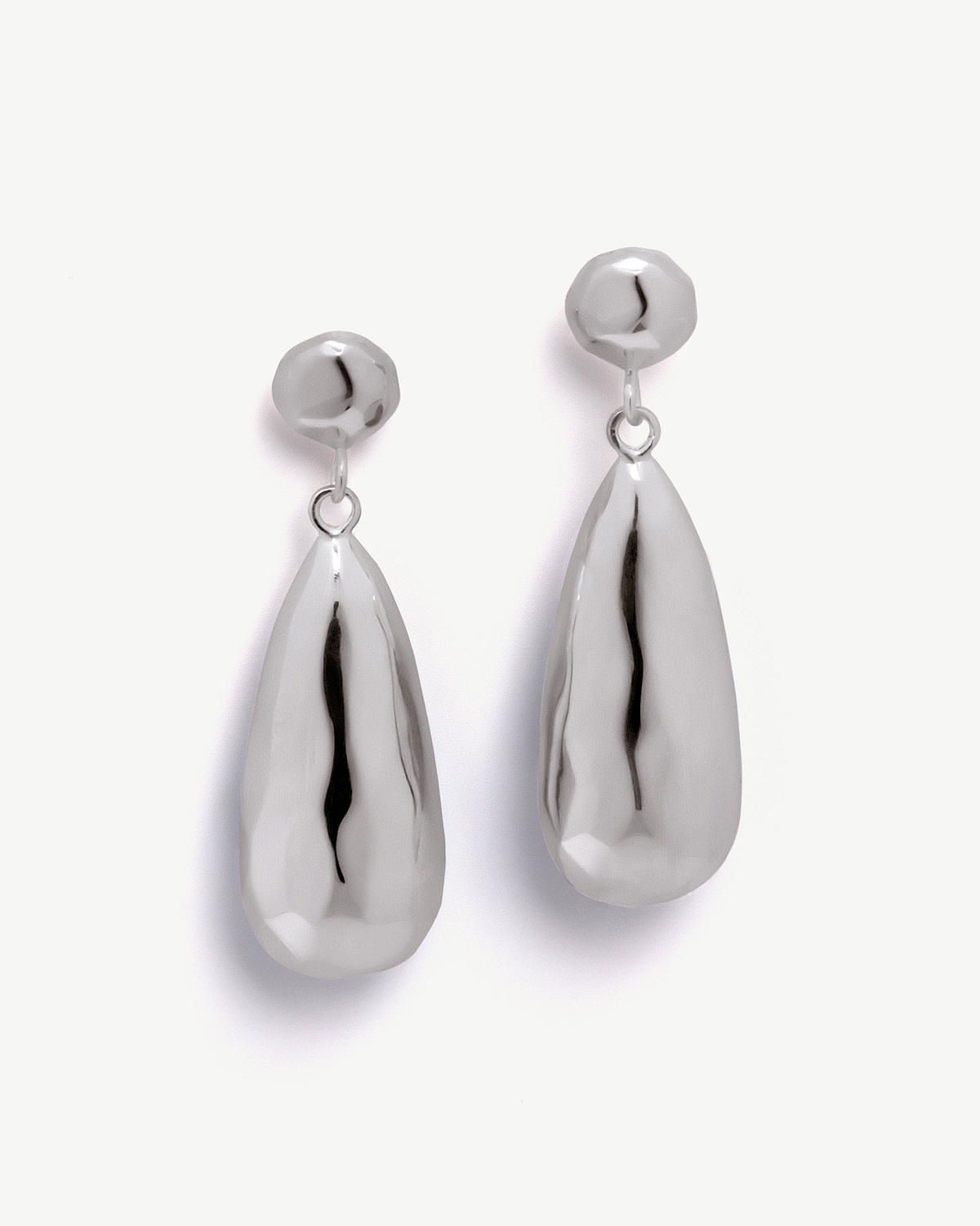 Pair of sterling silver Jasmine drop earrings on white background.