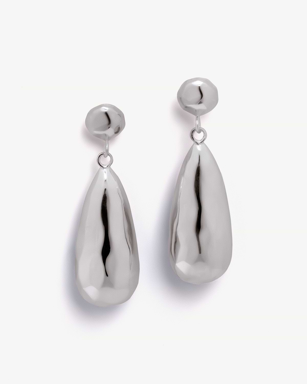 Pair of sterling silver Jasmine drop earrings on white background.