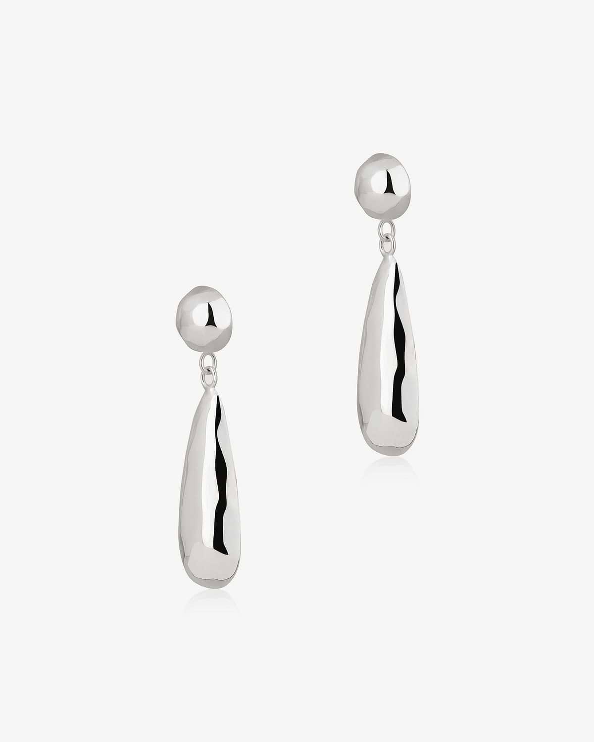 Pair of sterling silver drop Jasmine earrings with polished teardrop dangles.
