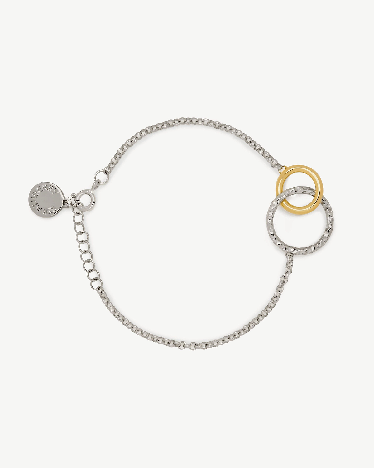 Sterling silver chain bracelet with 24-carat gold-gilded halo rings and Strathberry tag.