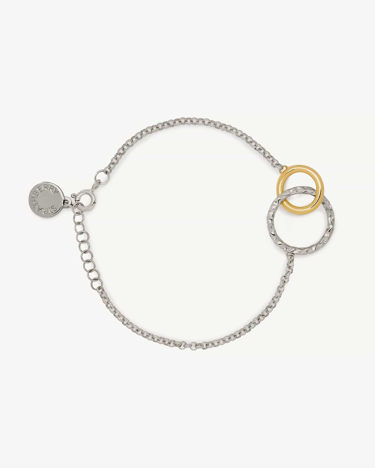 Sterling silver chain bracelet with 24-carat gold-gilded halo rings and Strathberry tag.