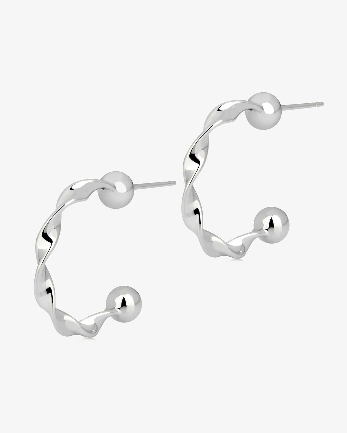 Pair of sterling silver twisted crescent hoop earrings with ball end posts.