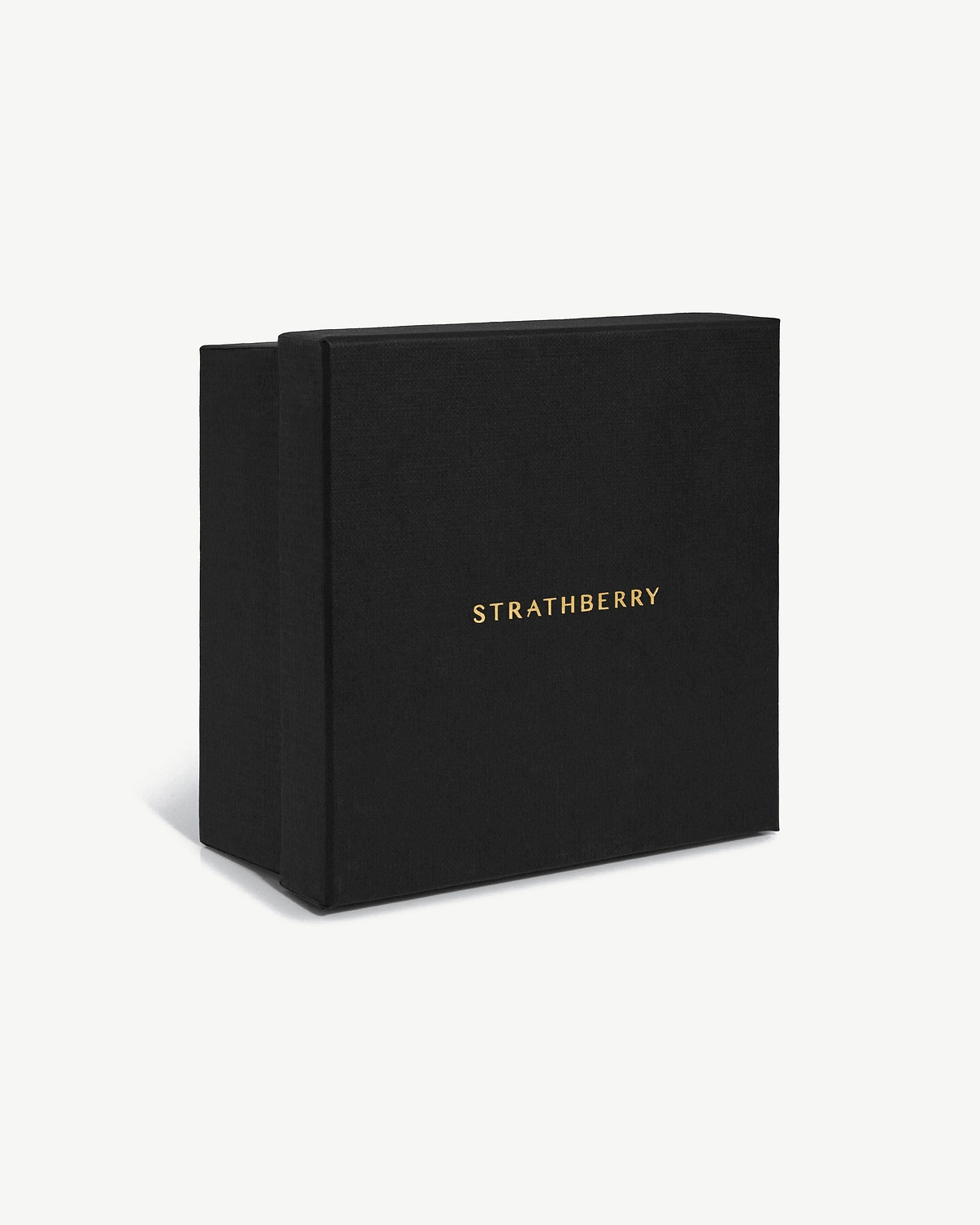 Black gift box with gold Strathberry logo on white background.