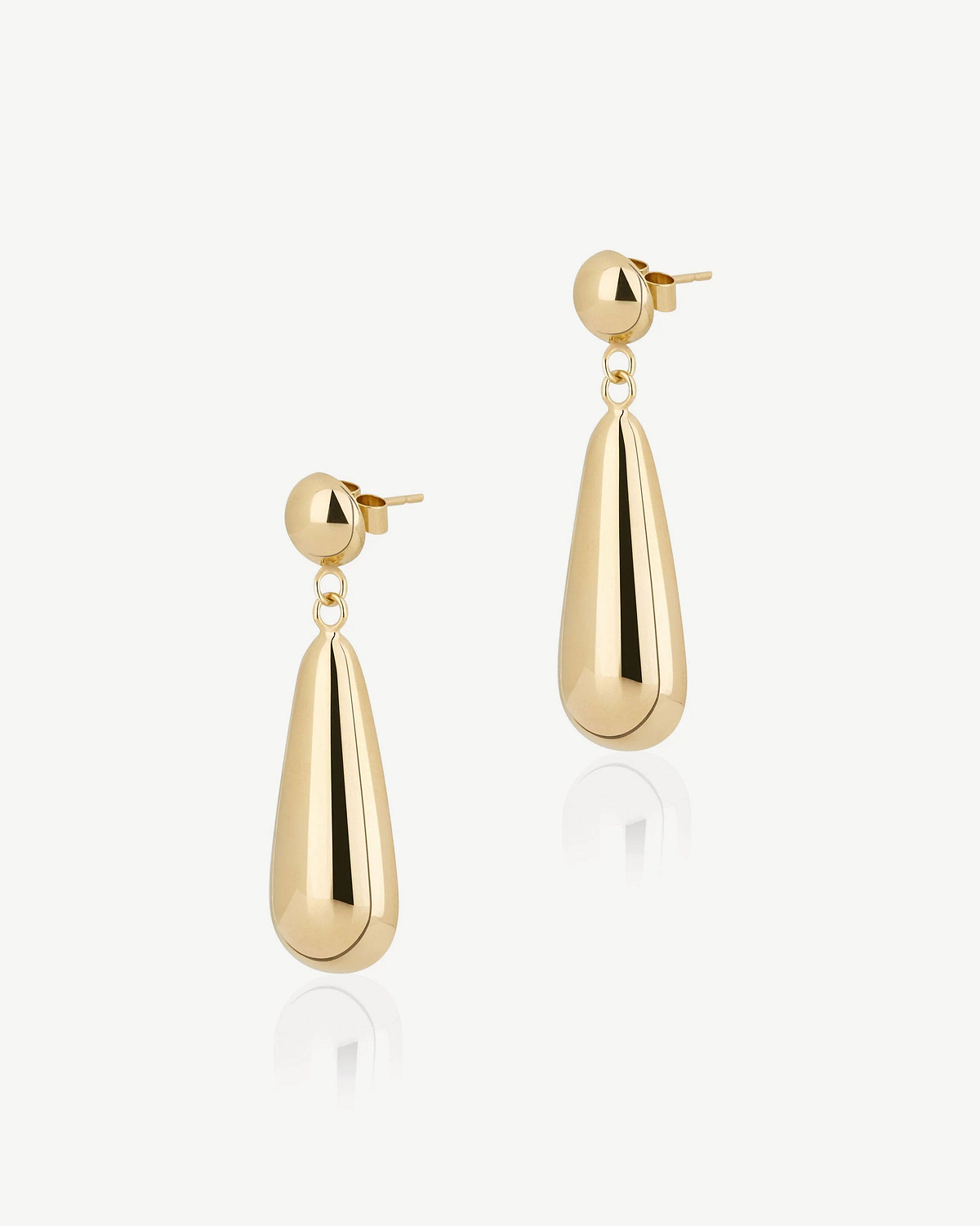 Pair of 24 carat gold-gilded Jasmine drop earrings on white background.