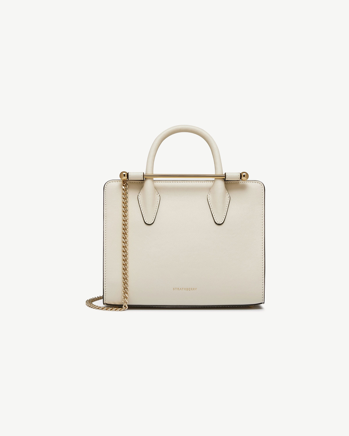 Vanilla leather mini tote with rounded top handles, gold metal bar, chain strap, Strathberry logo.
