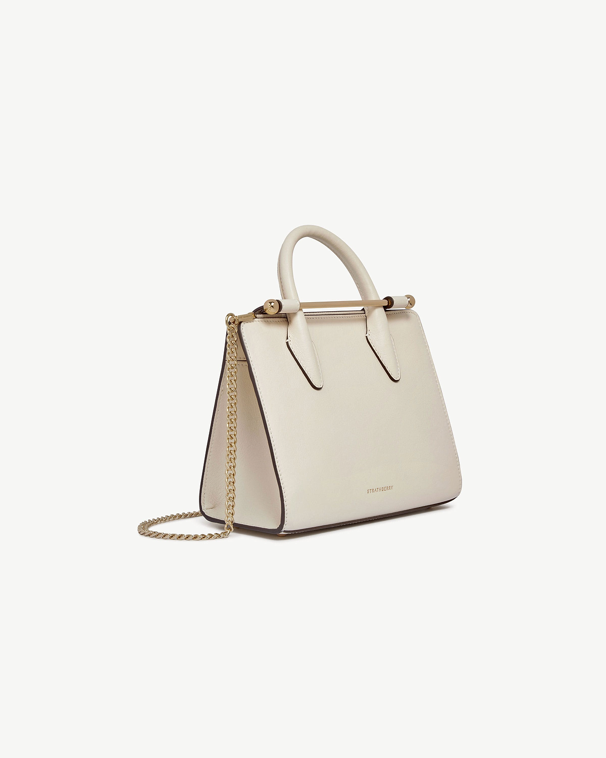 Vanilla mini tote with gold chain strap and metal top bar, Strathberry.