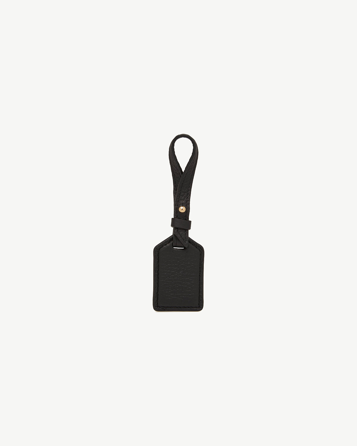 Black leather tag with loop strap, stitched edges and a small gold stud.