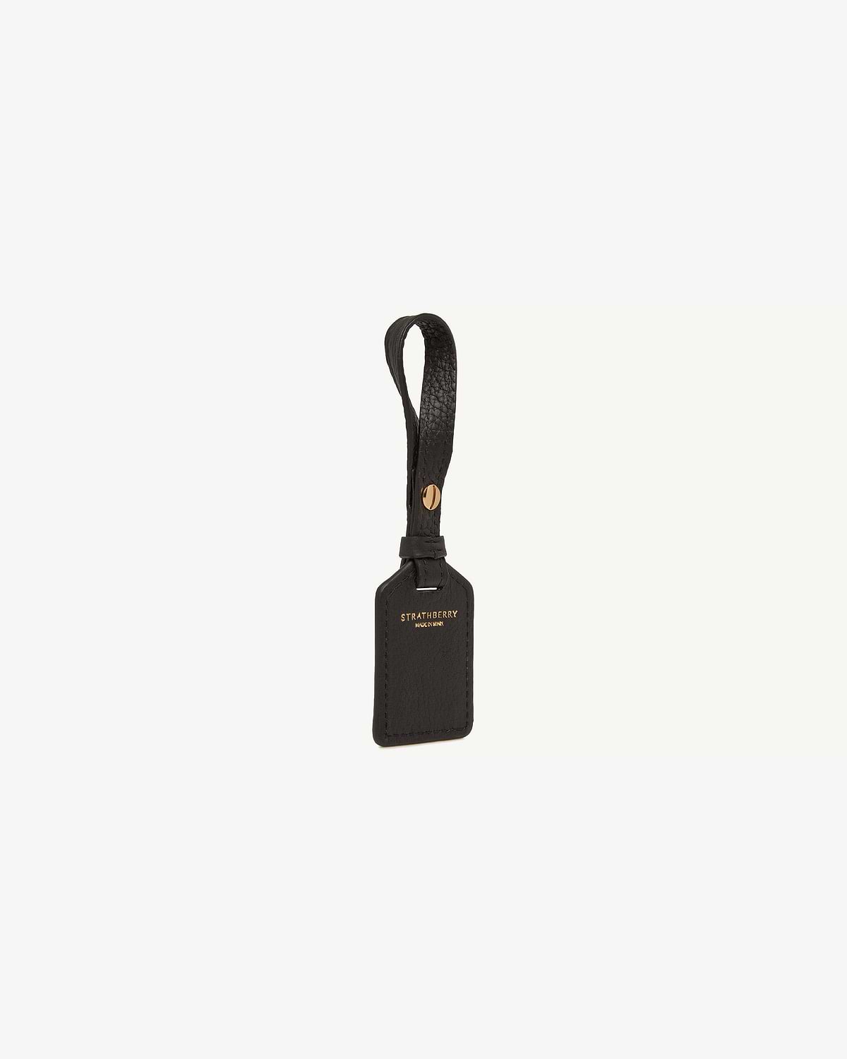 Black leather tag with Strathberry gold logo and looped strap.