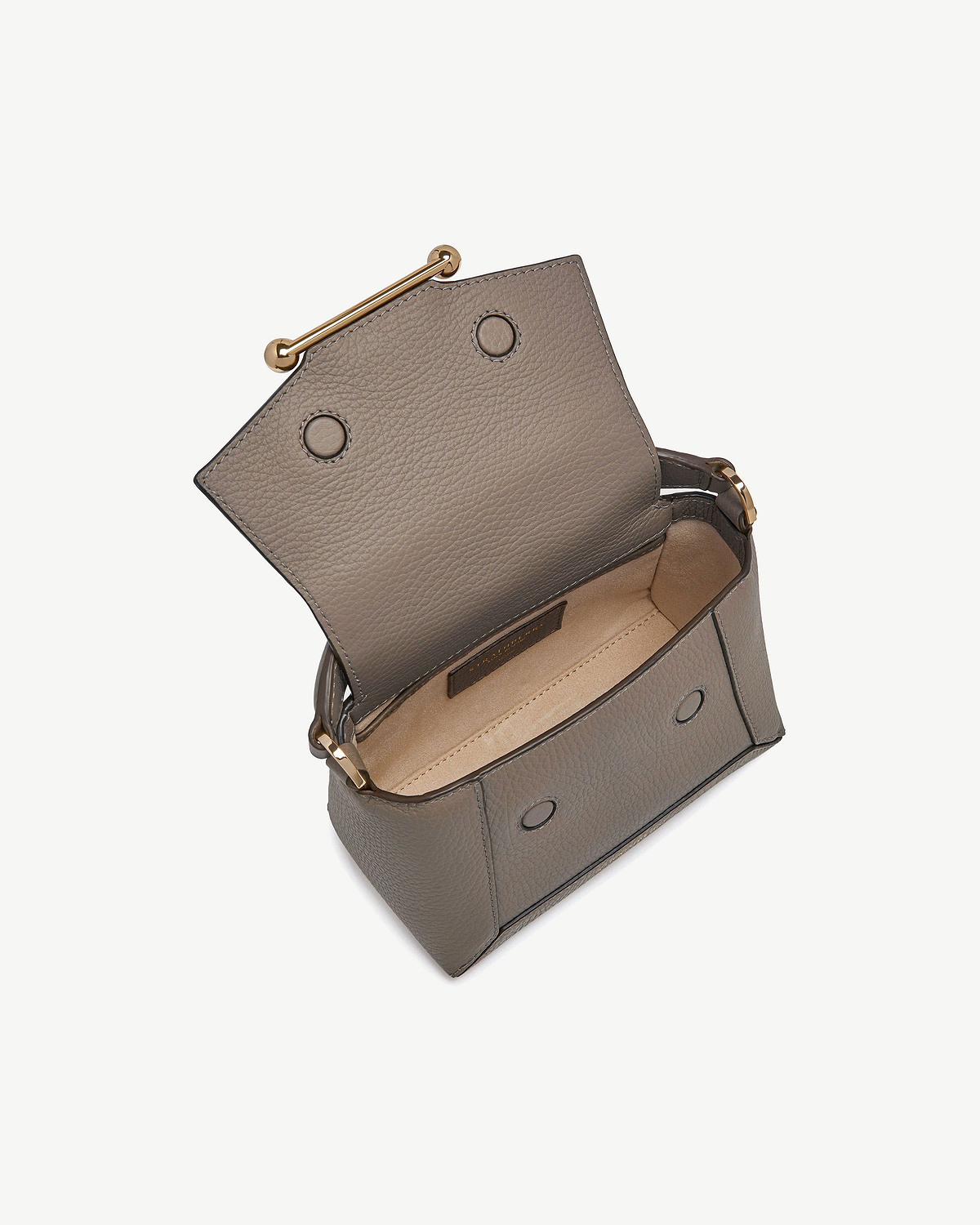 Open taupe textured leather nano shoulder bag showing interior and gold hardware.