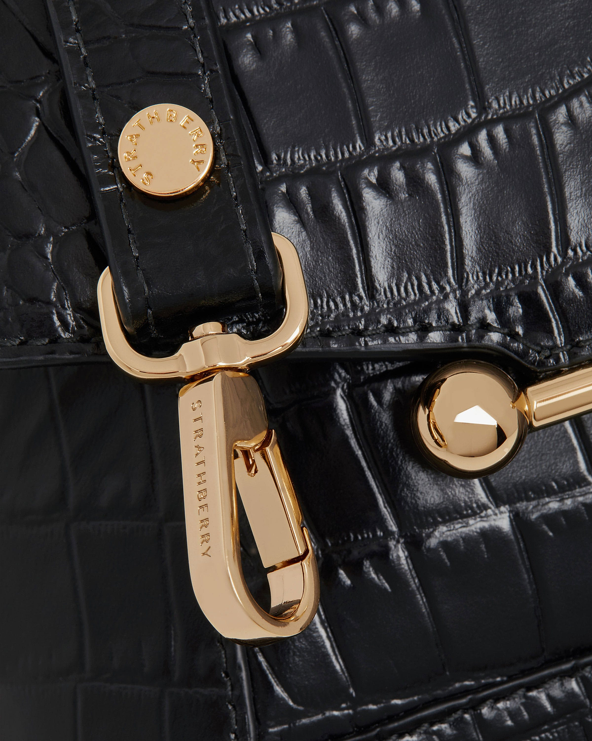 Black soft-croc leather with Strathberry gold hardware and clasp detail