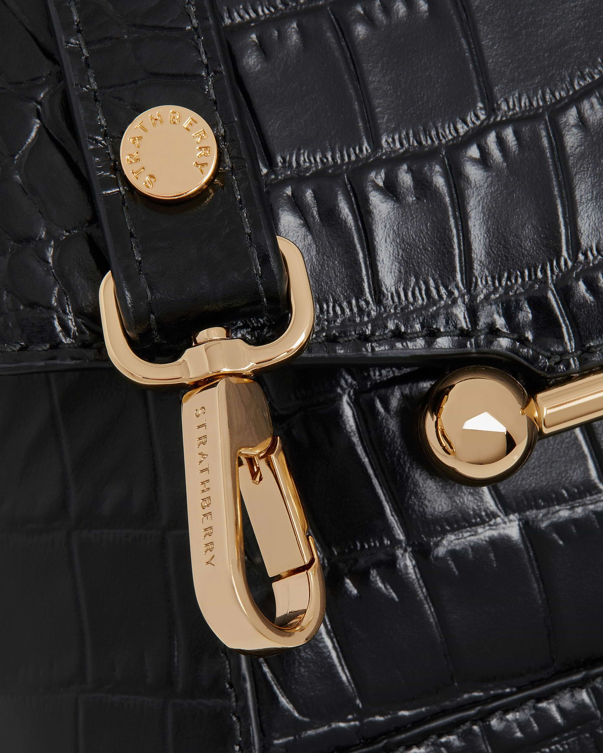 Black soft-croc leather with Strathberry gold hardware and clasp detail