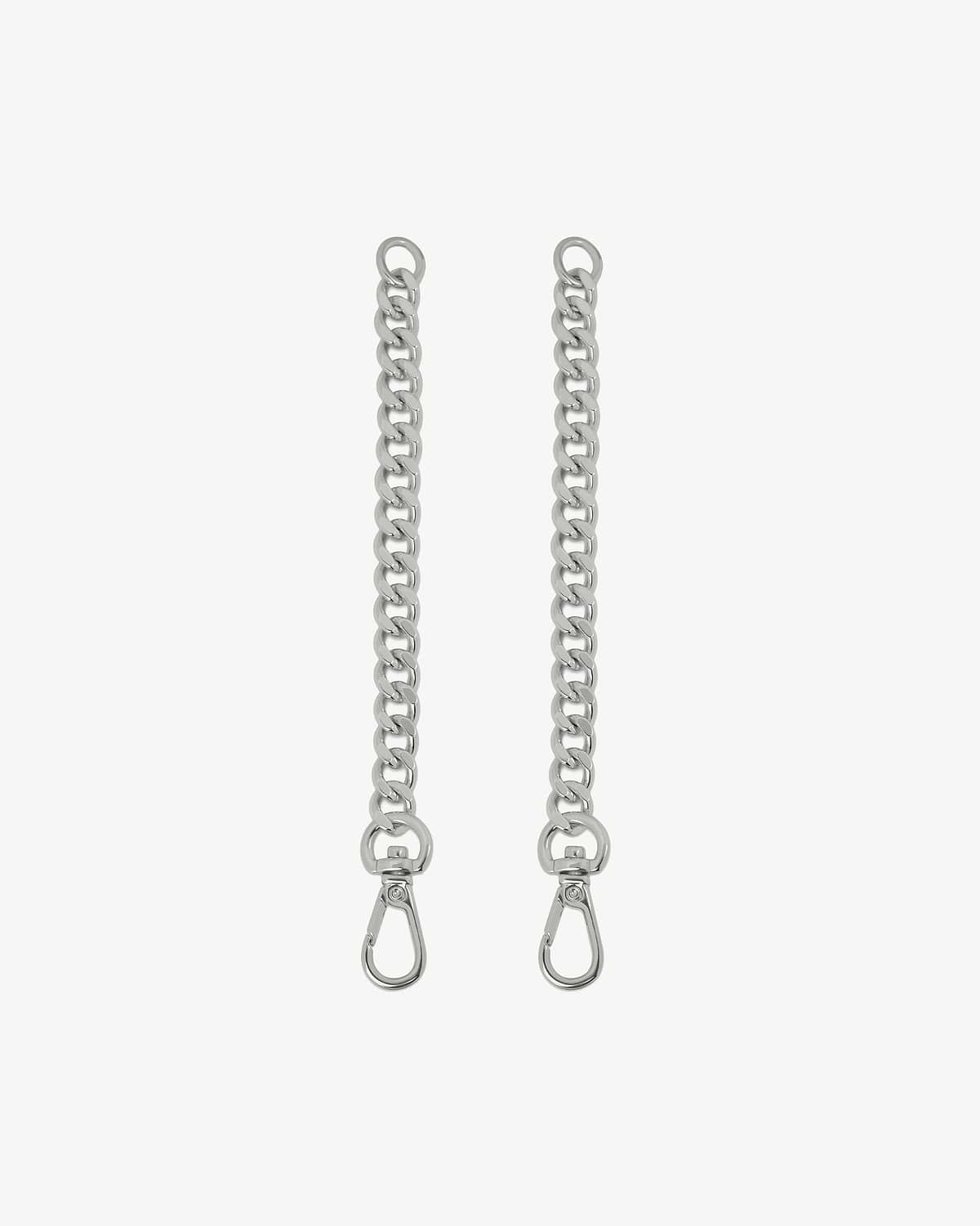 Two silver chain extenders with lobster clasps on a white background