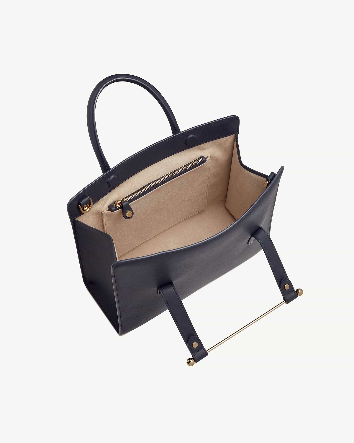 Marine blue midi tote with beige lining, interior zip pocket and gold hardware.