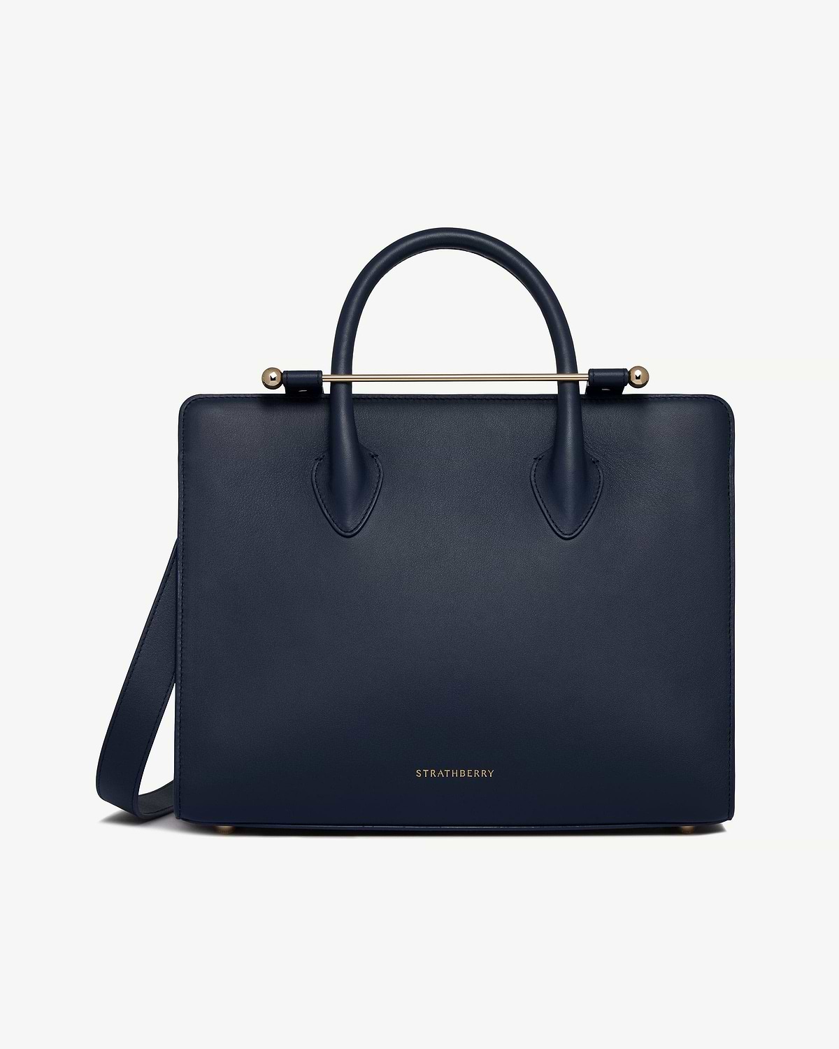 Marine blue leather midi tote with top handles, shoulder strap, and gold Strathberry logo.