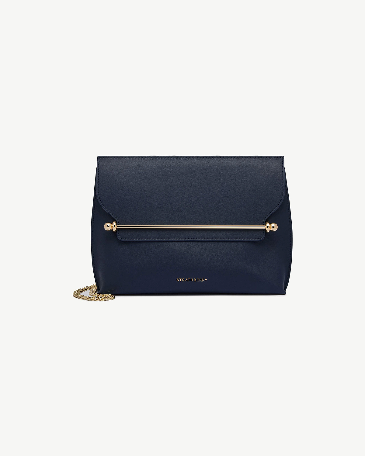 Strathberry Stylist bag in marine blue with gold bar and chain strap.