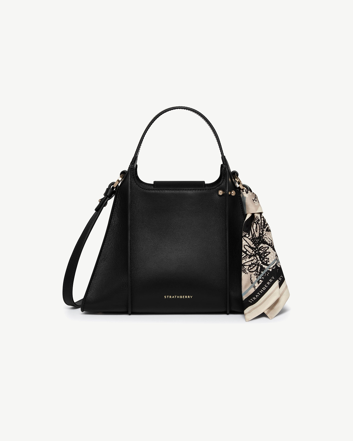 Black Strathberry Arkshell bag with top handle, shoulder strap, gold hardware and patterned scarf