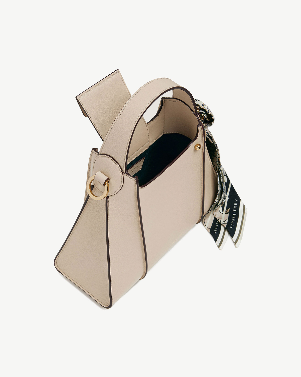 Oat Arkshell leather bag with top handle and a patterned tied scarf.