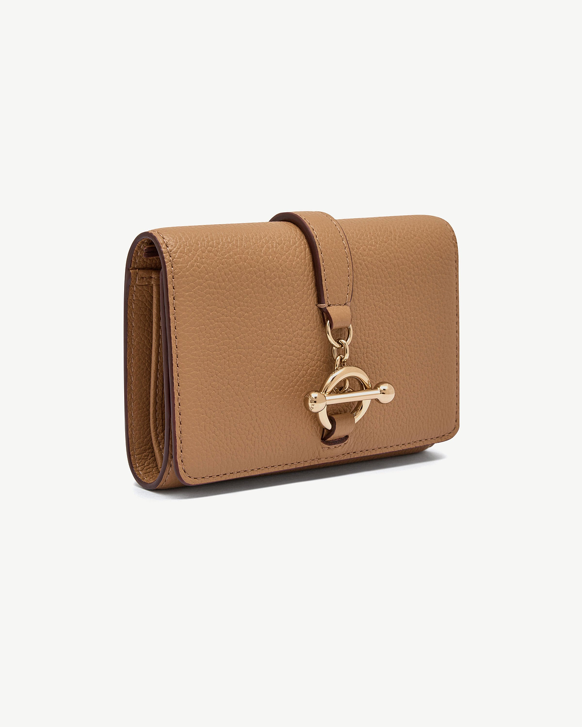Caramel trifold wallet in pebbled leather with gold circular turn-lock fastener.