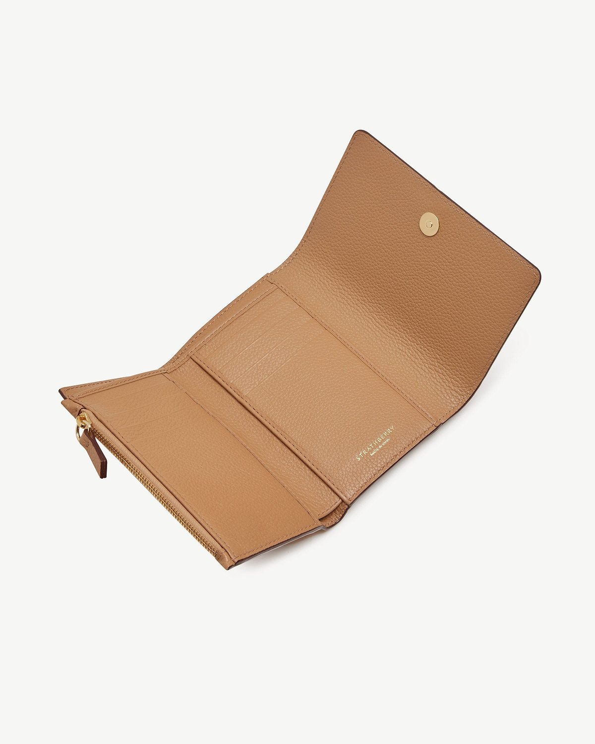 Caramel Strathberry trifold wallet open showing card slots and zipped coin pocket.