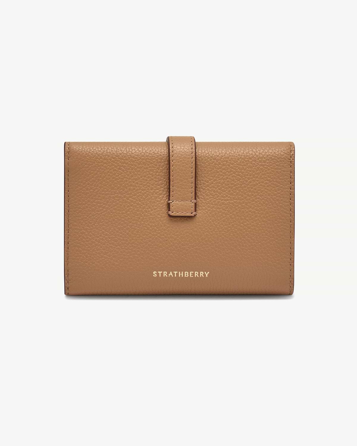 Caramel pebbled leather Kite medium trifold wallet with gold Strathberry logo and strap.