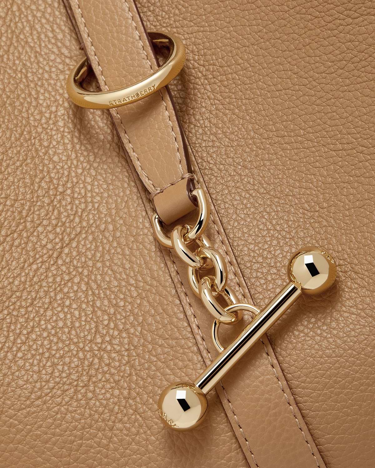 Caramel pebbled leather with Strathberry engraved ring, gold chain and toggle