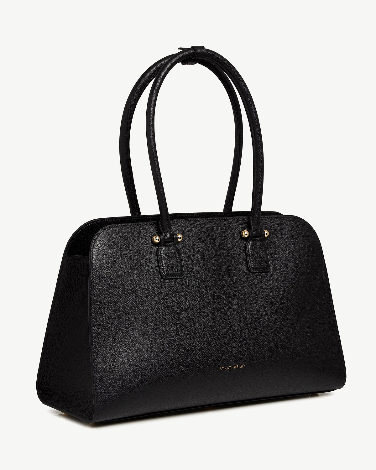 Black pebbled leather Strathberry tote bag with double top handles and gold hardware.