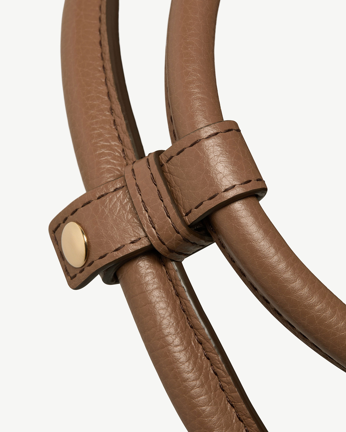 Clay leather bag handles with stitched strap and gold stud detail.