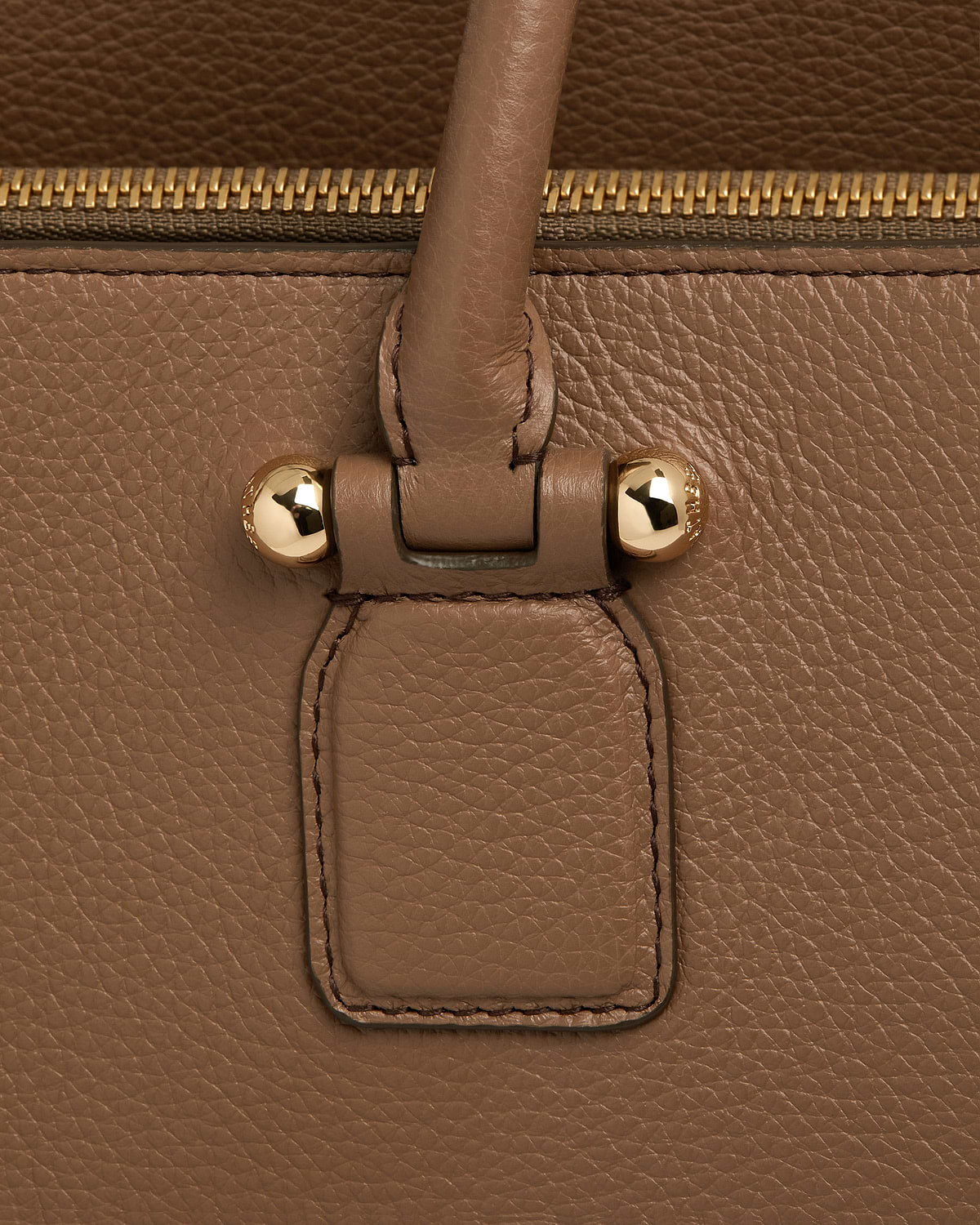 Clay pebbled leather bag handle attachment with gold studs and zip