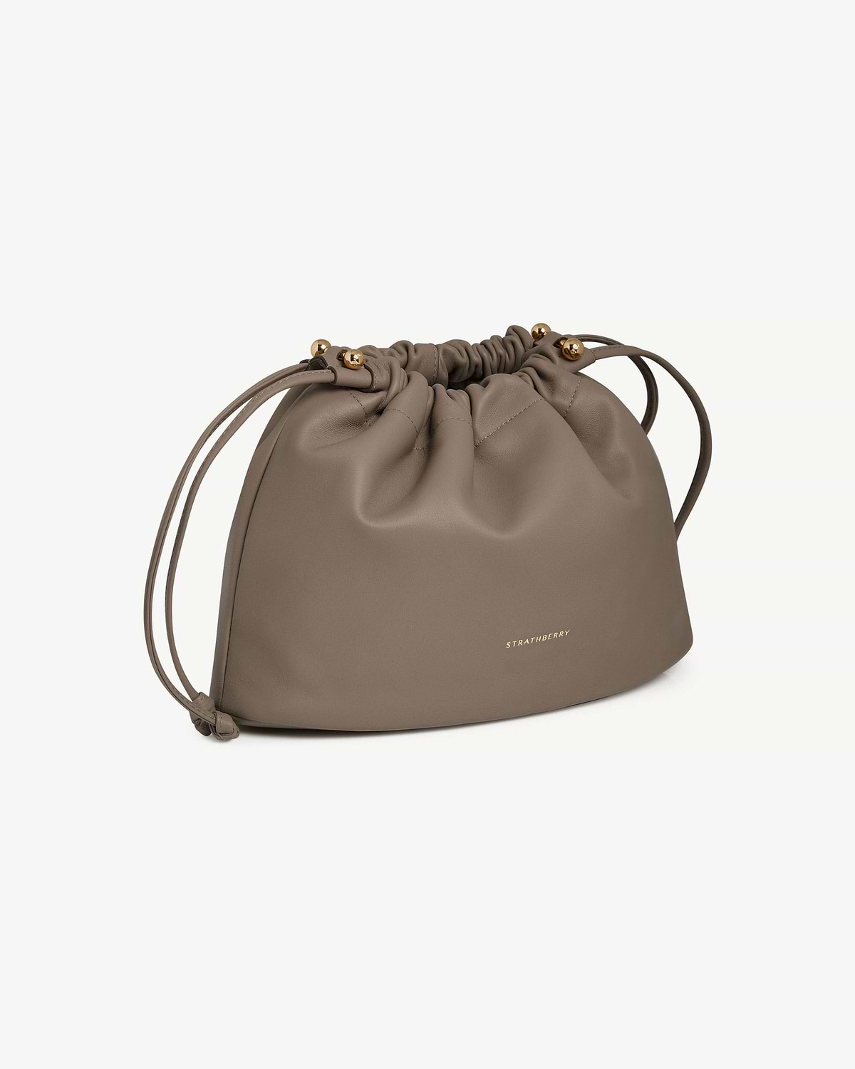 Taupe drawstring leather bag with gold bead ends and Strathberry logo.