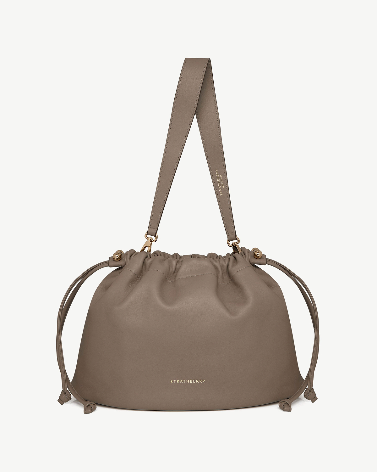 Strathberry Charlotte Midi drawstring bag in taupe with gold hardware and wide strap