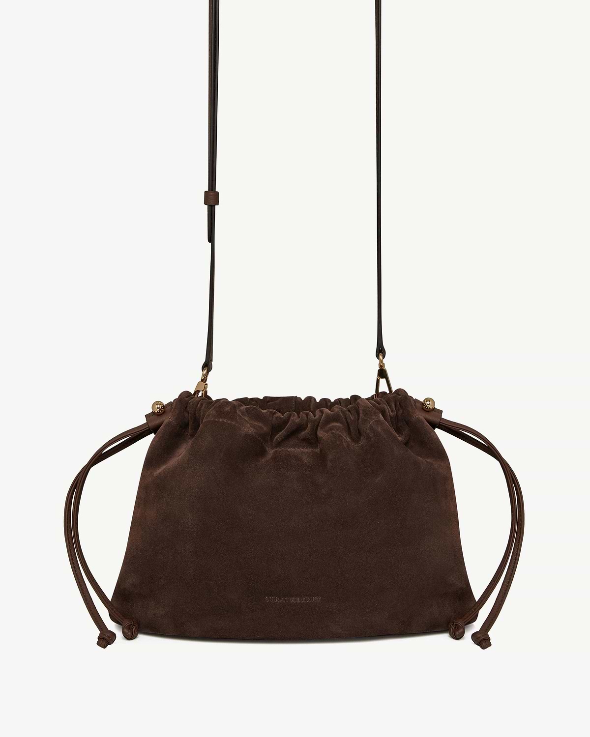 Chocolate suede drawstring bag with long leather shoulder strap and knotted side cords