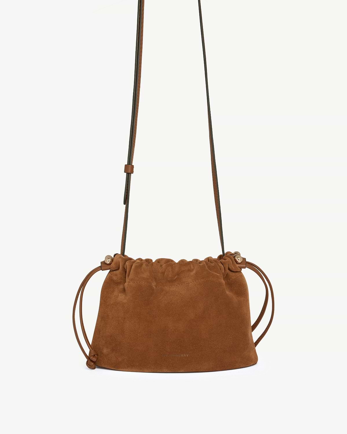 Tan suede drawstring bag with long adjustable leather shoulder strap