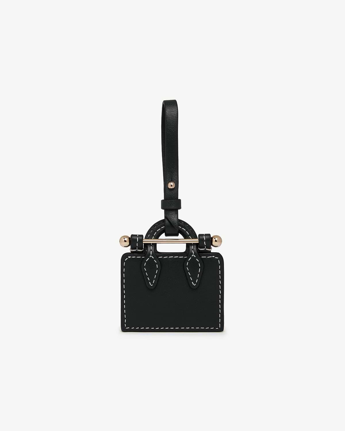 Black tote-shaped charm with white stitching, gold-tone bar and strap loop.