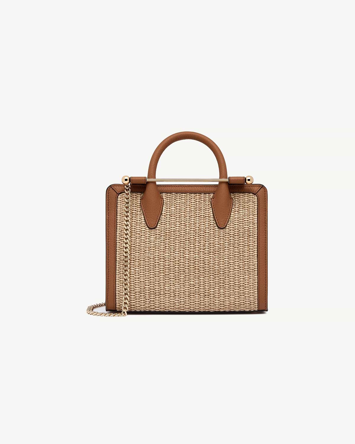 Tan leather-trim mini tote with natural raffia body, top handle and gold chain strap