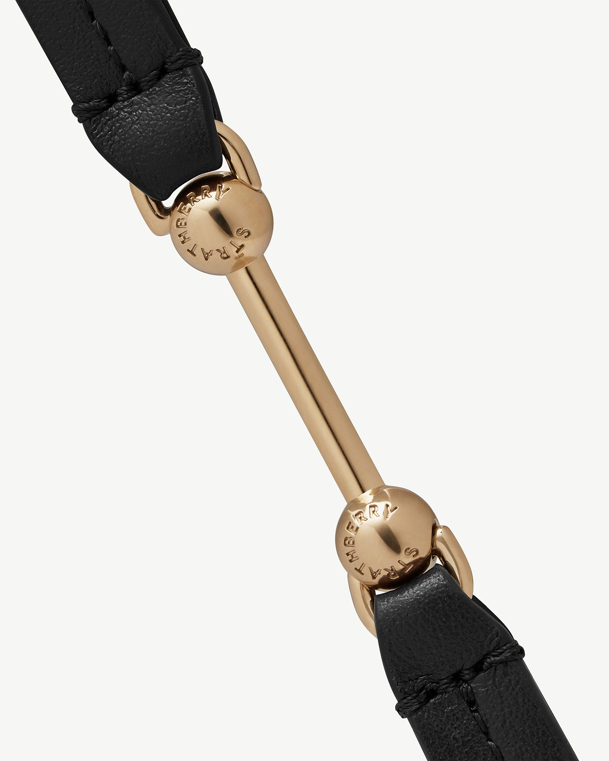 Black leather double-wrap bracelet with gold-toned bar and Strathberry logo.