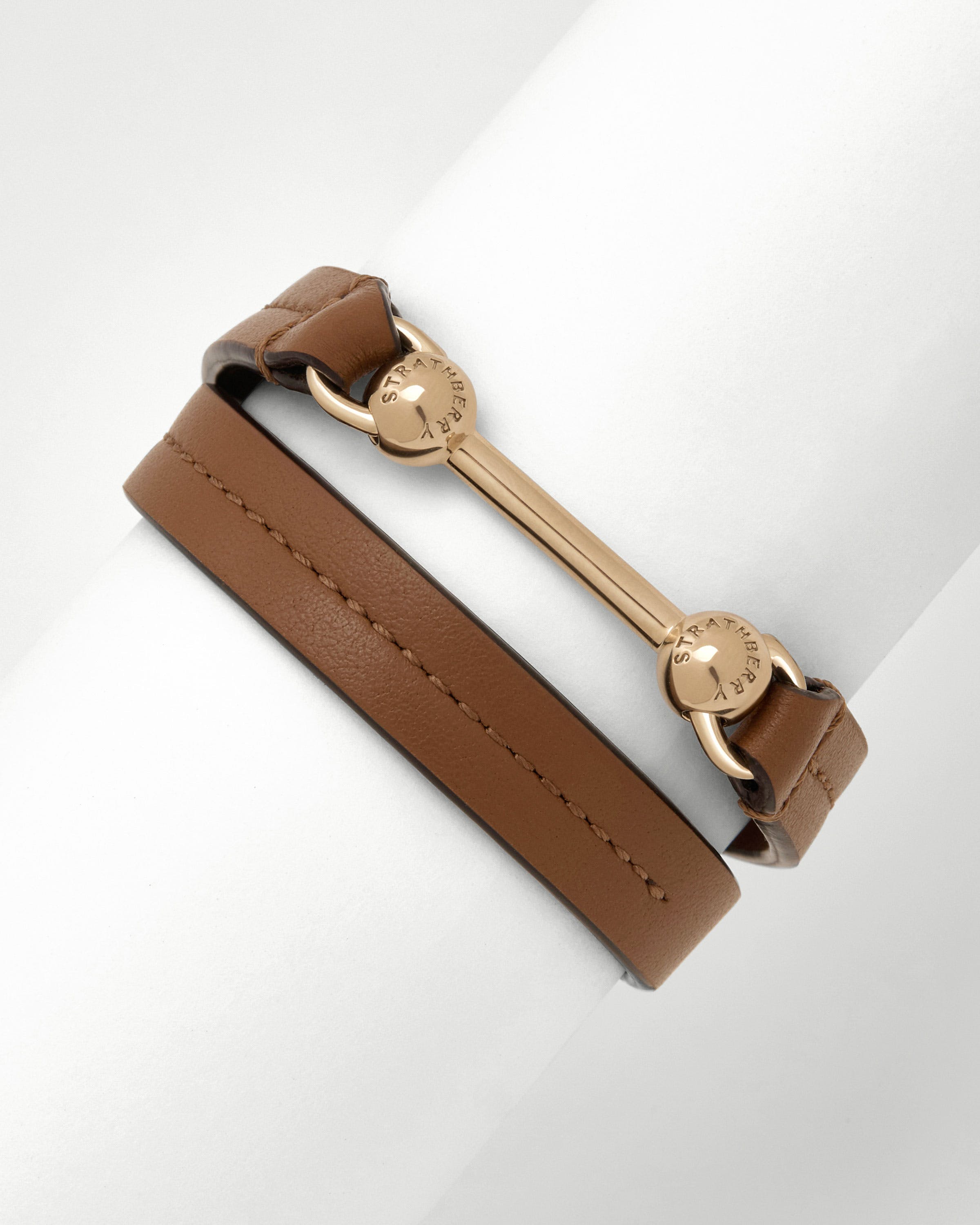 Hazelnut leather double-wrap bracelet with Strathberry gold bar and rings.